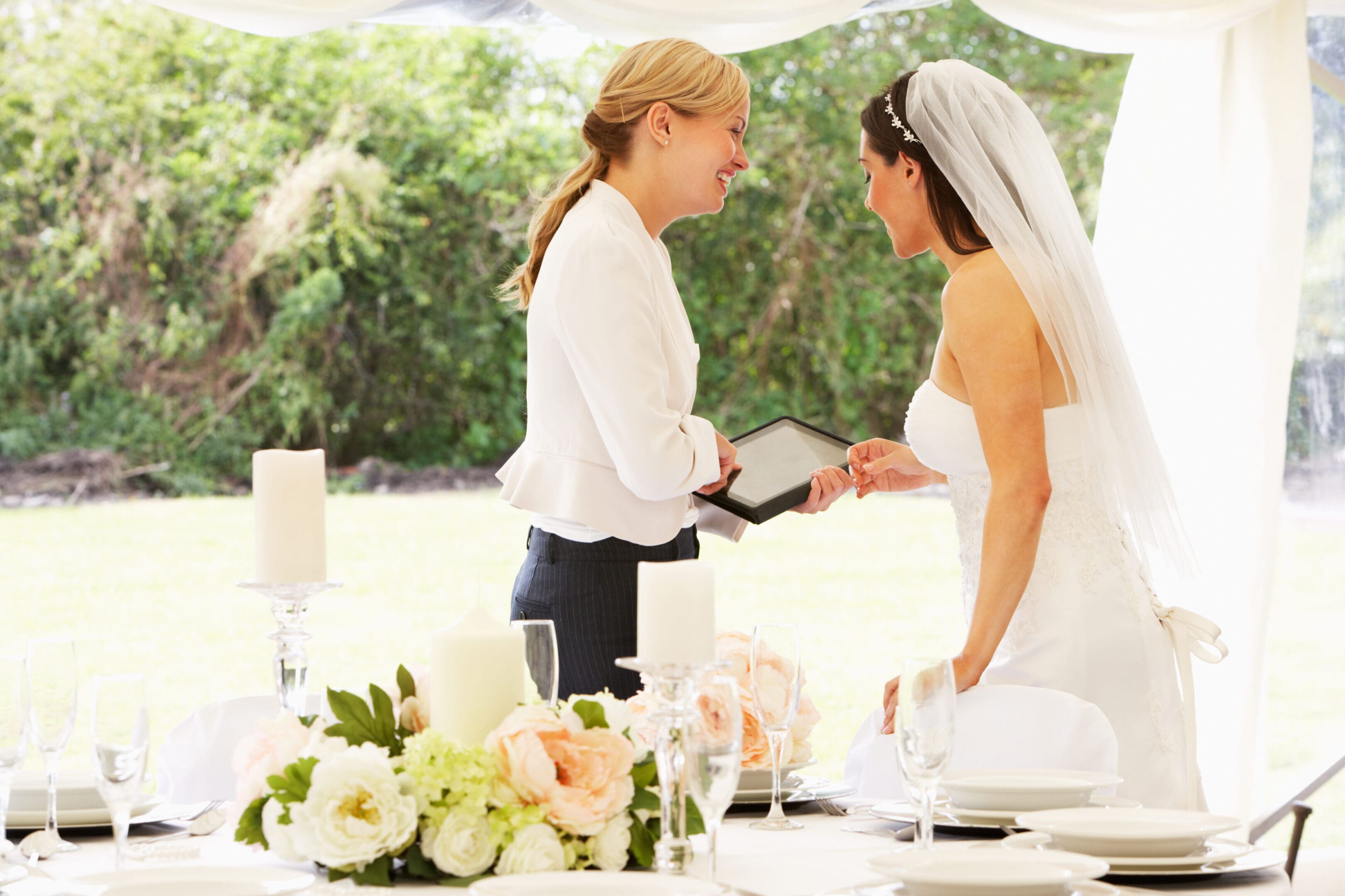 Bride and planner reviewing wedding details.